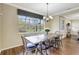 Bright dining area with a farmhouse table and built-in bench seating at 29205 Saddlebag Trl, Myakka City, FL 34251