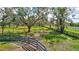 Pasture with wooden fence and mature trees at 29205 Saddlebag Trl, Myakka City, FL 34251