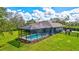 Inviting screened pool and patio area, perfect for outdoor entertaining at 29205 Saddlebag Trl, Myakka City, FL 34251
