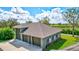 Attached three-car garage with gray exterior at 29205 Saddlebag Trl, Myakka City, FL 34251