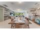 Open concept dining area with wood table and six chairs at 322 Suwanee Ave, Sarasota, FL 34243