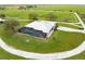 An aerial view of a home with a pool and circular driveway at 3630 Verna Rd, Myakka City, FL 34251