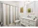 Clean bathroom with a white vanity and shower/tub combo at 3630 Verna Rd, Myakka City, FL 34251