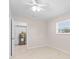 Spacious bedroom with tile floors and access to laundry facilities at 4457 Brooksdale Dr, Sarasota, FL 34232