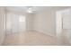 Spacious bedroom with tile floors and access to other rooms at 4457 Brooksdale Dr, Sarasota, FL 34232