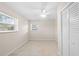 Simple bedroom with tile floors and ample closet space at 4457 Brooksdale Dr, Sarasota, FL 34232