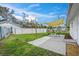 Backyard with patio, shade sail, and grassy area at 4457 Brooksdale Dr, Sarasota, FL 34232
