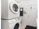 Laundry room with stackable Samsung washer and dryer at 4457 Brooksdale Dr, Sarasota, FL 34232