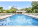 Relaxing community pool with ample deck space at 4873 Village Gardens Dr # 191, Sarasota, FL 34234