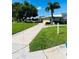 Pathway through grassy area with community building at 6517 Oregon St, Bradenton, FL 34207