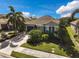 Single-Gathering house with a two-car garage, driveway, and manicured lawn at 805 Molly Cir, Sarasota, FL 34232