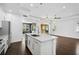 Modern kitchen with white cabinets, granite island, and stainless steel appliances at 805 Molly Cir, Sarasota, FL 34232