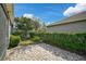 Paver patio and backyard featuring lush greenery and well-maintained landscaping at 805 Molly Cir, Sarasota, FL 34232
