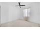 Bright bedroom with modern ceiling fan and a large window at 805 Molly Cir, Sarasota, FL 34232