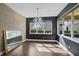 Bright dining room with large windows, modern lighting, and a decorative mirror at 805 Molly Cir, Sarasota, FL 34232