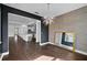 Dining room with modern lighting, textured wallpaper, and a view into the kitchen at 805 Molly Cir, Sarasota, FL 34232