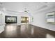 Spacious living area with sliding doors leading to a patio and hardwood floors at 805 Molly Cir, Sarasota, FL 34232