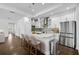 Bright, modern kitchen featuring a large island with marble countertops and stainless steel appliances at 805 Molly Cir, Sarasota, FL 34232