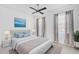 Bedroom featuring ceiling fan, two windows, and a modern aesthetic at 805 Molly Cir, Sarasota, FL 34232