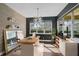 Modern office space featuring sleek desk, statement lighting, and large windows for natural light at 805 Molly Cir, Sarasota, FL 34232