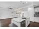 Modern kitchen with white cabinets, granite island, and stainless steel appliances at 805 Molly Cir, Sarasota, FL 34232