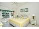 Main bedroom with bay window and seashell-themed decor at 9489 Millbank Dr # 2625, Sarasota, FL 34238