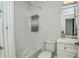 Clean bathroom with tub shower combo, toilet and vanity at 9489 Millbank Dr # 2625, Sarasota, FL 34238