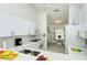Modern white kitchen with stainless steel appliances at 9489 Millbank Dr # 2625, Sarasota, FL 34238