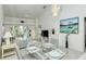 Bright and airy living room, dining area, and balcony access at 9489 Millbank Dr # 2625, Sarasota, FL 34238