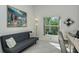 Home office featuring a sofa bed, large window, and built-in desk at 9489 Millbank Dr # 2625, Sarasota, FL 34238