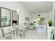 Bright living room with dining area and access to balcony at 9489 Millbank Dr # 2625, Sarasota, FL 34238