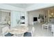 Sunroom with table and chairs, view of garden and living area at 9489 Millbank Dr # 2625, Sarasota, FL 34238