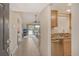 Bright and spacious entryway leading to the living room and kitchen at 1100 Capri Isles Blvd # 523, Venice, FL 34292
