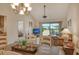 Bright dining area with view into living room and bedroom at 1100 Capri Isles Blvd # 523, Venice, FL 34292