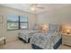 Guest bedroom with twin beds and window coverings at 1100 Capri Isles Blvd # 523, Venice, FL 34292