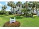 Lakes of Capri building entrance with lush landscaping at 1100 Capri Isles Blvd # 523, Venice, FL 34292