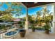Balcony overlooking an outdoor water view with lush greenery and potted plants at 1243 Starboard Ln, Sarasota, FL 34242