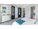 Bedroom with gray walls, white trim, carpet, a dresser, and built in bookshelves; with hallway and closet access at 1243 Starboard Ln, Sarasota, FL 34242