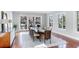 Elegant dining room with large table, hardwood floors, and sliding glass doors to the outside at 1243 Starboard Ln, Sarasota, FL 34242