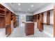 Spacious walk-in closet with custom shelving and storage solutions at 1243 Starboard Ln, Sarasota, FL 34242