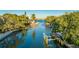 Scenic canal view showcasing waterfront property with private docks surrounded by mature trees and lush landscaping at 1243 Starboard Ln, Sarasota, FL 34242
