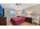 Guest bedroom with a queen bed and ceiling fan at 134 Da Vinci Dr, Nokomis, FL 34275