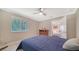 Well-lit bedroom with a window and wooden floors at 134 Da Vinci Dr, Nokomis, FL 34275