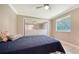 Spacious bedroom with mirrored closet doors and a ceiling fan at 134 Da Vinci Dr, Nokomis, FL 34275