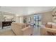 Bright living room with large window and comfortable seating at 134 Da Vinci Dr, Nokomis, FL 34275