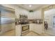 Modern kitchen with stainless steel appliances and granite countertops at 134 Da Vinci Dr, Nokomis, FL 34275