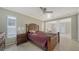 Bedroom with wood bed frame and access to backyard at 134 Da Vinci Dr, Nokomis, FL 34275