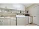 Laundry room with washer, dryer and cabinets at 134 Da Vinci Dr, Nokomis, FL 34275