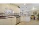Updated kitchen, featuring white cabinets and granite countertops at 134 Da Vinci Dr, Nokomis, FL 34275