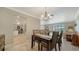 Open dining room with view into kitchen and living room at 134 Da Vinci Dr, Nokomis, FL 34275